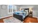 Cozy bedroom with plantation shutters, hardwood floors, and stylish decor at 2707 Waterpointe Cir, Mount Pleasant, SC 29466