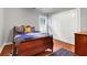 Comfortable bedroom with hardwood floors, plantation shutters, and a spacious closet at 2707 Waterpointe Cir, Mount Pleasant, SC 29466