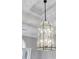 Close-up of a stylish chandelier with decorative trim and lighting at 2707 Waterpointe Cir, Mount Pleasant, SC 29466