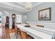 Elegant dining room featuring wainscoting, stylish lighting, and hardwood flooring at 2707 Waterpointe Cir, Mount Pleasant, SC 29466
