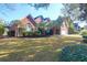 Attractive home exterior with lush landscaping and mature palm trees at 2707 Waterpointe Cir, Mount Pleasant, SC 29466