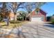 Charming brick home boasts a two-car garage, mature landscaping, and a well-manicured lawn, set on a sunny lot at 2707 Waterpointe Cir, Mount Pleasant, SC 29466