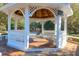 Relax in the community gazebo on a wood deck that overlooks the tennis courts and landscaped grounds at 2707 Waterpointe Cir, Mount Pleasant, SC 29466