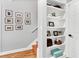 Hallway with staircase, hardwood floors, and built-in storage shelves at 2707 Waterpointe Cir, Mount Pleasant, SC 29466