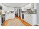 Well-lit kitchen with ample cabinet space, modern appliances, and hardwood floors at 2707 Waterpointe Cir, Mount Pleasant, SC 29466
