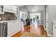Open concept kitchen with stainless appliances, white cabinets, and views to other living spaces at 2707 Waterpointe Cir, Mount Pleasant, SC 29466