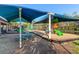 Community playground with colorful play structures and a shaded seating area, perfect for Gathering fun at 2707 Waterpointe Cir, Mount Pleasant, SC 29466