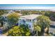 Aerial shot of a beautiful home, showcasing its location near the beach with surrounding greenery at 3006 Cameron Blvd, Isle of Palms, SC 29451