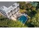 Beautiful home featuring multiple decks, outdoor seating, and a private backyard pool with water feature at 3006 Cameron Blvd, Isle of Palms, SC 29451