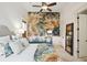 Inviting bedroom showcasing a decorative mural, large bed, mirrored dresser and modern decor at 3006 Cameron Blvd, Isle of Palms, SC 29451