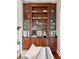 Custom wood built-in bookshelves with glass doors providing lots of display space at 3006 Cameron Blvd, Isle of Palms, SC 29451