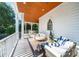 Inviting covered porch with comfortable seating perfect for outdoor relaxation with privacy and views at 3006 Cameron Blvd, Isle of Palms, SC 29451