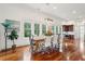 Dining area with hardwood floors, stylish chandelier, and plenty of natural light at 3006 Cameron Blvd, Isle of Palms, SC 29451
