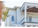 Close-up of the house, featuring a window, eaves and trim, and a second-story porch at 3006 Cameron Blvd, Isle of Palms, SC 29451