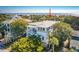 A beautiful multi-story coastal home featuring spacious decks, a modern design, and great curb appeal at 3006 Cameron Blvd, Isle of Palms, SC 29451