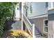 Exterior stairs leading to a charming home entrance, enhancing curb appeal and offering a welcoming transition from outdoors at 3006 Cameron Blvd, Isle of Palms, SC 29451