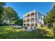 Spacious home with multiple decks overlooking a beautiful pool and backyard, offering stunning outdoor living and entertaining at 3006 Cameron Blvd, Isle of Palms, SC 29451