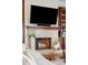 Stone fireplace with detailed woodworking, flat screen television and built-in shelves at 3006 Cameron Blvd, Isle of Palms, SC 29451