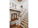 Two-story foyer with a staircase, glass paneled doors and a wood ceiling at 3006 Cameron Blvd, Isle of Palms, SC 29451