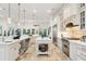 Bright kitchen with a large island, stainless steel appliances, and a prep sink at 3006 Cameron Blvd, Isle of Palms, SC 29451