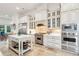 A chef's kitchen with stainless steel appliances, custom cabinetry, and lots of natural light at 3006 Cameron Blvd, Isle of Palms, SC 29451