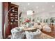 Cozy living room with built-in bookshelves, comfortable seating, and wood floors at 3006 Cameron Blvd, Isle of Palms, SC 29451