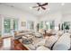 Spacious living room with hardwood floors, lots of natural light, and comfortable seating at 3006 Cameron Blvd, Isle of Palms, SC 29451