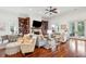 Expansive living area with built-in bookcases, a fireplace, and hardwood floors at 3006 Cameron Blvd, Isle of Palms, SC 29451