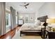 Main bedroom featuring wood floors, natural light, and ensuite bathroom at 3006 Cameron Blvd, Isle of Palms, SC 29451