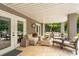 Elegant outdoor lounge with plush seating, serene ambiance, and access to the outdoor pool at 3006 Cameron Blvd, Isle of Palms, SC 29451