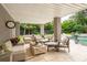 Inviting covered patio features comfortable seating, perfect for relaxing and enjoying the outdoor space at 3006 Cameron Blvd, Isle of Palms, SC 29451
