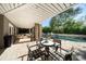 Beautiful patio with outdoor seating and a view of the fountain in the pool at 3006 Cameron Blvd, Isle of Palms, SC 29451