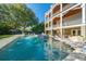 Stunning in-ground pool with a fountain feature, surrounded by outdoor seating and a multi-story home at 3006 Cameron Blvd, Isle of Palms, SC 29451