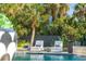 Inviting in-ground pool featuring lounge chairs and tropical landscaping, creating a serene and private outdoor space at 3006 Cameron Blvd, Isle of Palms, SC 29451