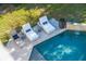 An aerial view of the outdoor pool area with cushioned chaise lounges, offering a relaxing poolside experience at 3006 Cameron Blvd, Isle of Palms, SC 29451