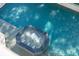 An aerial view of the octagon-shaped jacuzzi and the pool surrounded by sparkling, crystal clear water at 3006 Cameron Blvd, Isle of Palms, SC 29451