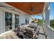 Image shows a covered porch with seating area, perfect for enjoying the outdoors at 3006 Cameron Blvd, Isle of Palms, SC 29451