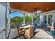 Relaxing porch with wooden ceiling, comfortable seating, and spiral staircase access at 3006 Cameron Blvd, Isle of Palms, SC 29451