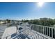 This rooftop deck offers ample seating with great views perfect for relaxing and entertaining at 3006 Cameron Blvd, Isle of Palms, SC 29451