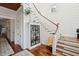 Staircase featuring a display cabinet, wood stairs with carpeting and white painted risers at 3006 Cameron Blvd, Isle of Palms, SC 29451