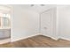 Bedroom with hardwood floors and ceiling fan; bathroom visible through doorway at 3105 Vanessa Lynne, Johns Island, SC 29455