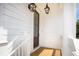 Inviting entryway featuring a wooden door, stylish lanterns, and white painted trim at 3105 Vanessa Lynne, Johns Island, SC 29455