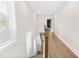 Hallway with hardwood floors, white walls, and natural light from a nearby window at 3105 Vanessa Lynne, Johns Island, SC 29455