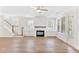 Spacious living room with a fireplace, hardwood floors, and bright natural light at 3105 Vanessa Lynne, Johns Island, SC 29455