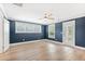 Large bedroom with blue walls, hardwood floors, ceiling fan, and a private balcony at 3105 Vanessa Lynne, Johns Island, SC 29455