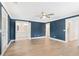 Spacious bedroom with blue accent wall, hardwood floors, and ensuite bathroom at 3105 Vanessa Lynne, Johns Island, SC 29455