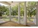 Screened-in porch with views of the surrounding trees and natural landscape, perfect for relaxing at 3105 Vanessa Lynne, Johns Island, SC 29455
