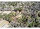 Aerial view of a single story home nestled among a lush green forest at 328 Fox Field Rd, Walterboro, SC 29488