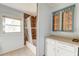 This bathroom features a vanity, tile floors, and a shower and tub combo with decorative tile surround at 328 Fox Field Rd, Walterboro, SC 29488
