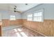 Bedroom featuring natural light, wood paneling, and ceiling fan at 328 Fox Field Rd, Walterboro, SC 29488